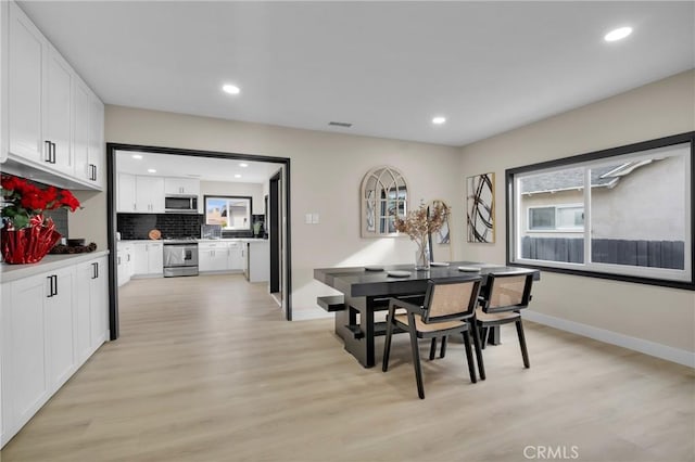 dining room featuring light hardwood / wood-style flooring