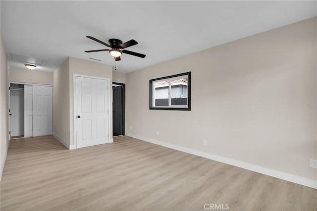 unfurnished bedroom with ceiling fan and light hardwood / wood-style flooring