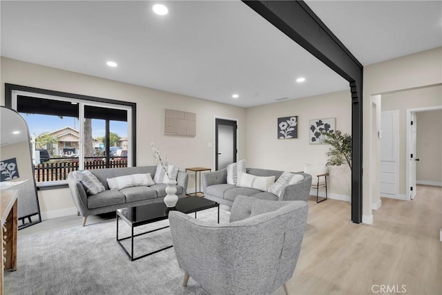 living room with light hardwood / wood-style flooring