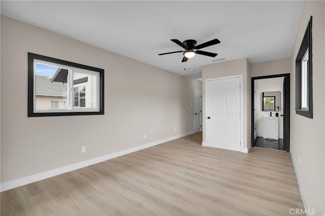 unfurnished bedroom with light wood-type flooring and ceiling fan