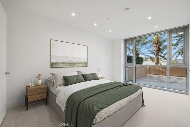 bedroom with access to exterior, carpet, and recessed lighting