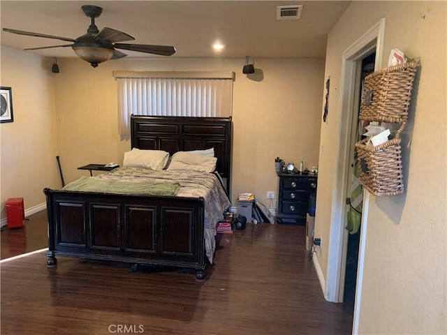 bedroom featuring ceiling fan and dark hardwood / wood-style flooring