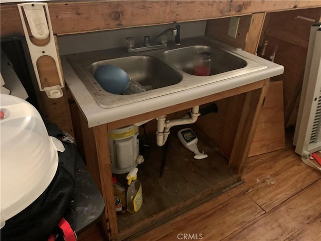 room details featuring hardwood / wood-style floors and sink