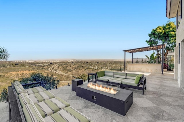 view of patio / terrace featuring a pergola and an outdoor living space with a fire pit