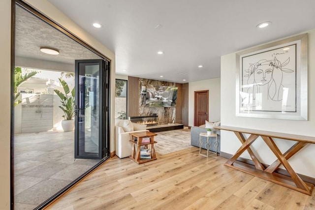 hall with light hardwood / wood-style flooring