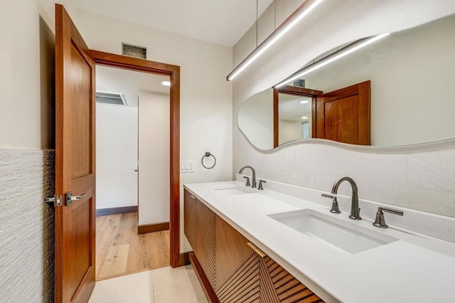 bathroom featuring wood-type flooring and vanity