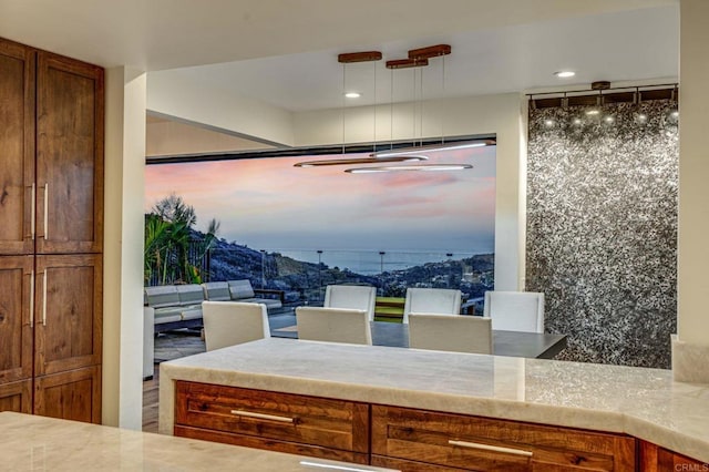 kitchen featuring a mountain view and pendant lighting