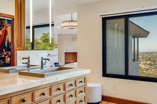 bathroom featuring vanity and a chandelier