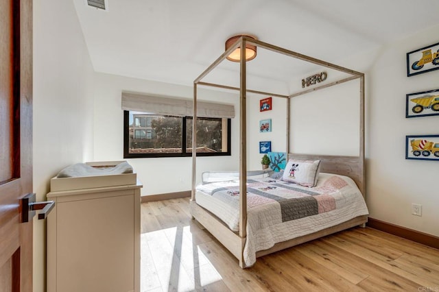 bedroom with light hardwood / wood-style floors