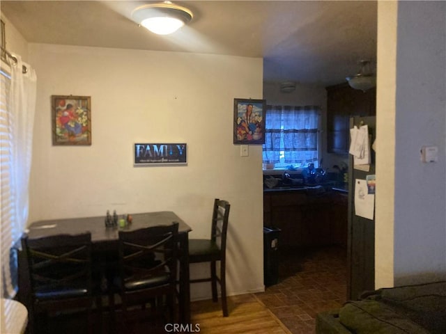 dining room with dark hardwood / wood-style flooring