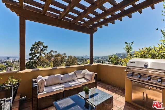 view of patio with an outdoor hangout area, a pergola, grilling area, and exterior kitchen