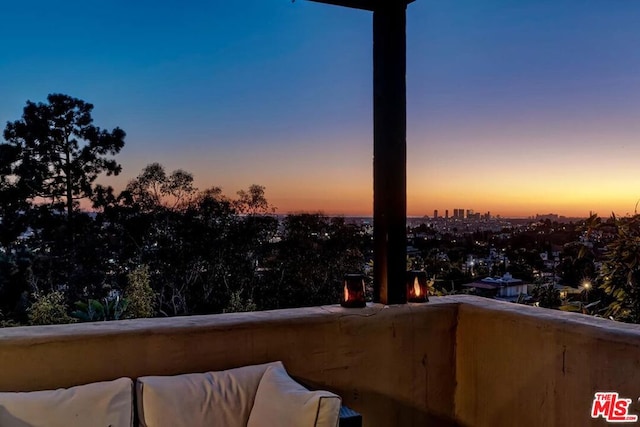 view of balcony at dusk