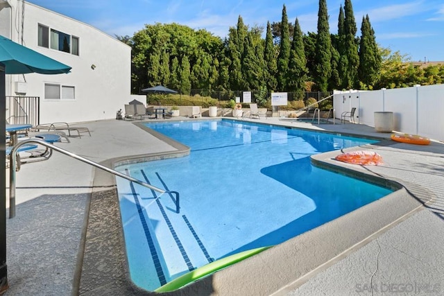 view of swimming pool featuring a patio area