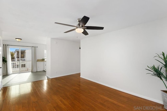 unfurnished room with ceiling fan and wood-type flooring