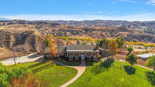 drone / aerial view featuring a mountain view