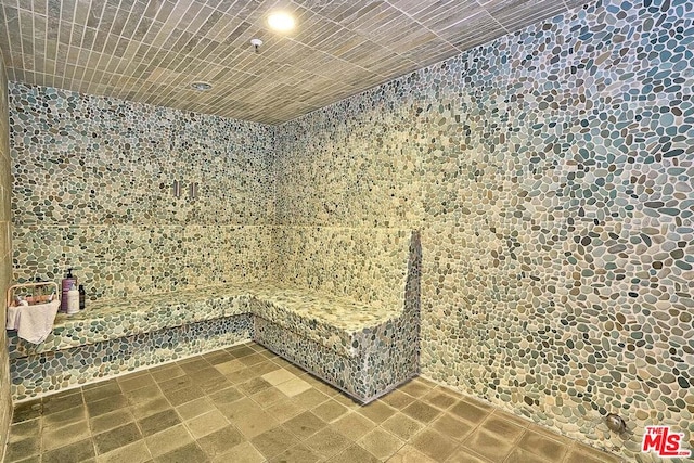 bathroom with tile walls