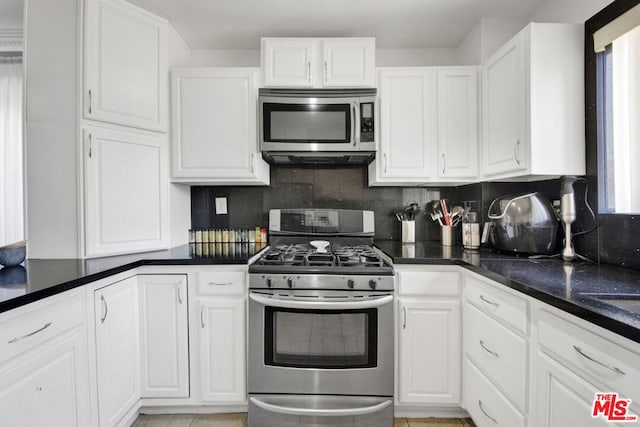 kitchen with white cabinetry and stainless steel appliances