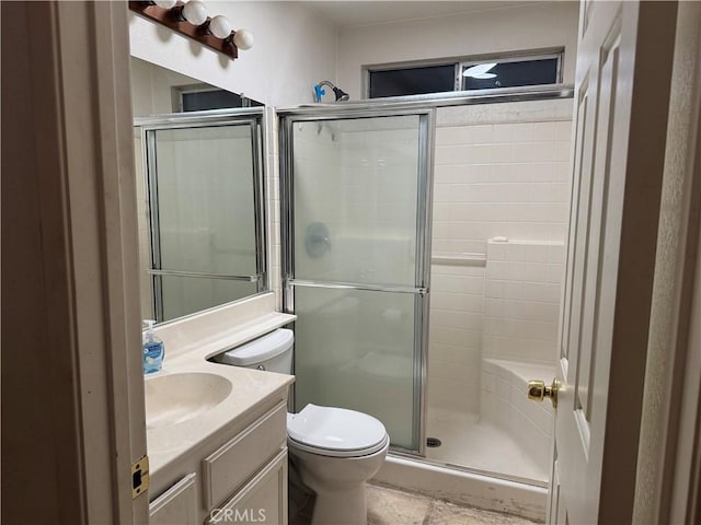 bathroom with a shower with door, toilet, and vanity