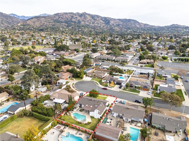 birds eye view of property with a mountain view