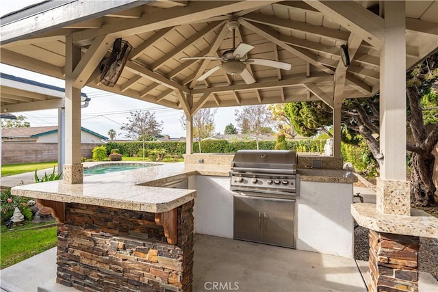 view of patio with a gazebo, ceiling fan, and area for grilling