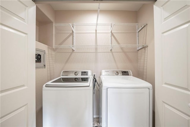 washroom with independent washer and dryer