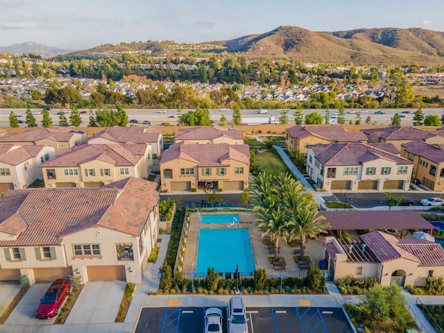 birds eye view of property featuring a mountain view