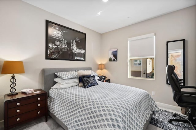 bedroom featuring light colored carpet