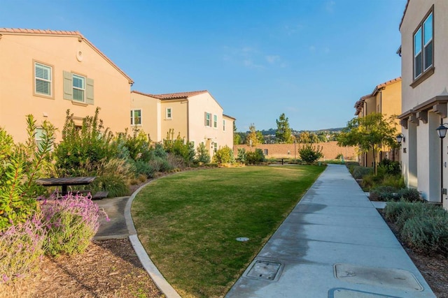 view of home's community featuring a yard