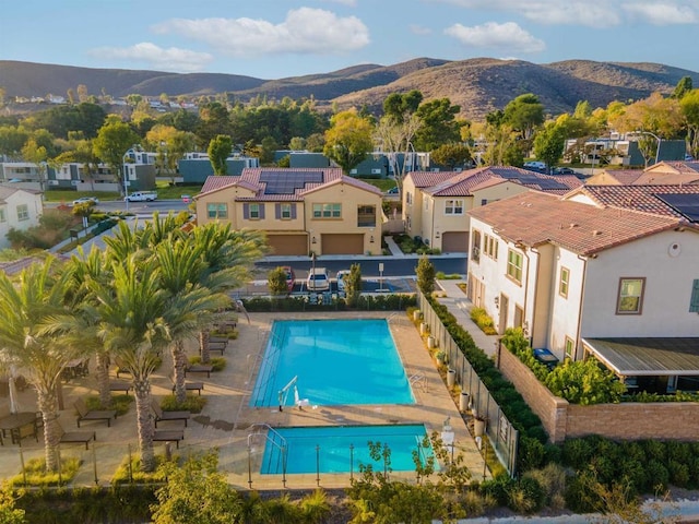 view of swimming pool with a mountain view