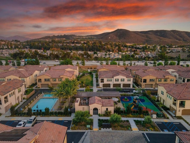 aerial view at dusk with a mountain view