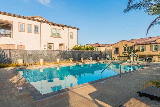 view of pool featuring a patio