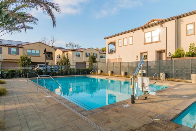 view of swimming pool featuring a patio area