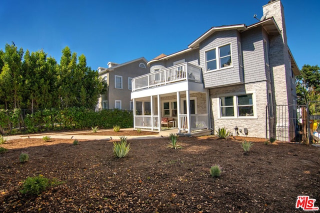 view of front of property with a balcony