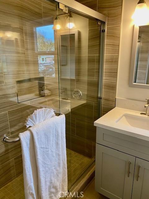 bathroom with vanity and walk in shower