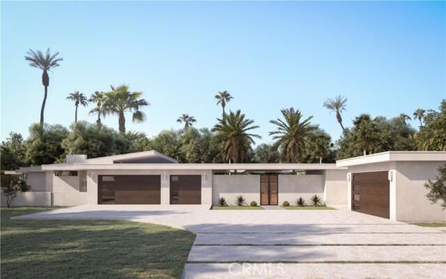 modern home featuring a garage and a front yard