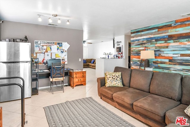 tiled living room with ceiling fan