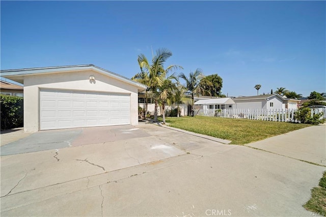 view of front of house with a front lawn and a garage