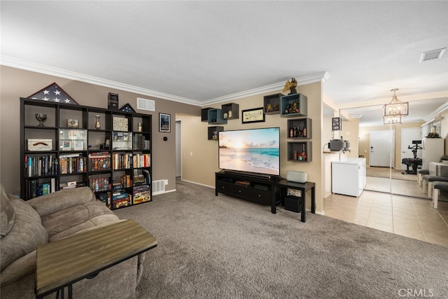 living room featuring light colored carpet, crown molding, and an inviting chandelier