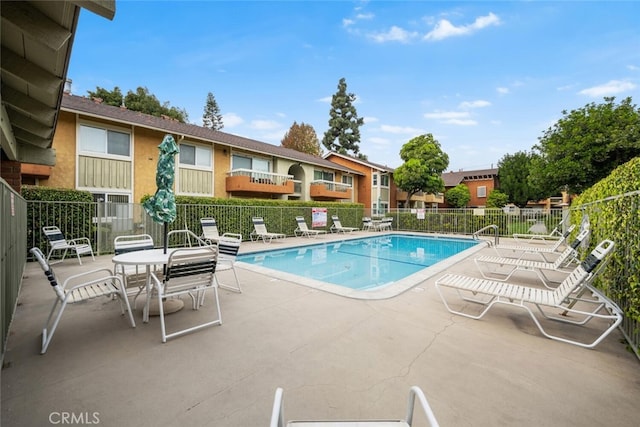 view of swimming pool featuring a patio area