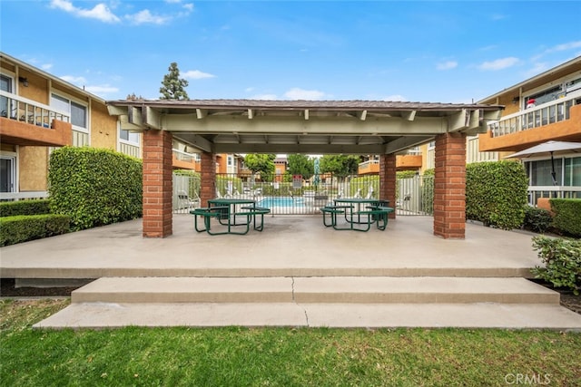 view of community with a patio and a swimming pool