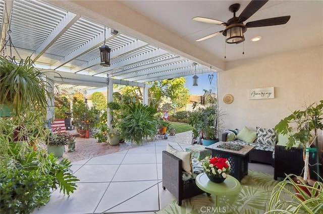 view of patio / terrace with ceiling fan, a pergola, and an outdoor living space with a fire pit