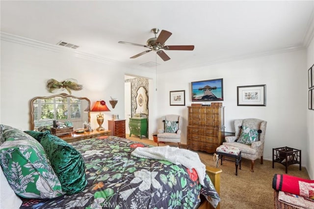 carpeted bedroom with ceiling fan and crown molding