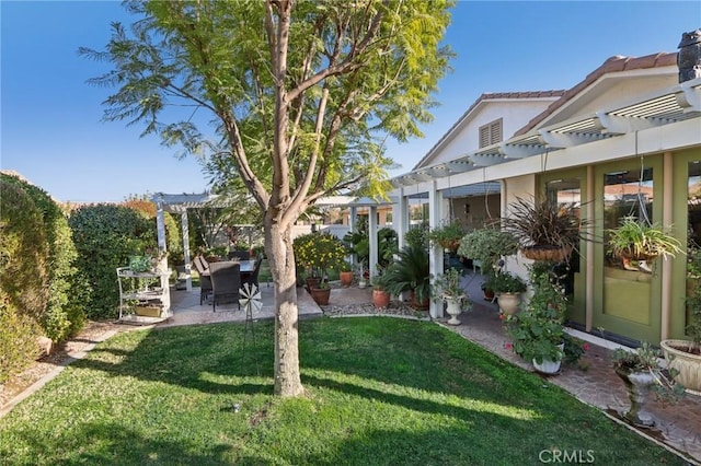 view of yard with a pergola and a patio area