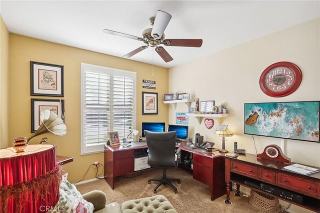 carpeted home office with ceiling fan