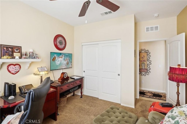 office area with light colored carpet and ceiling fan