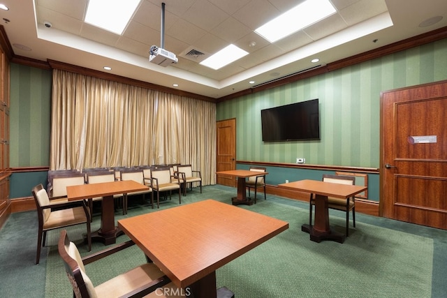 playroom with carpet floors and a tray ceiling