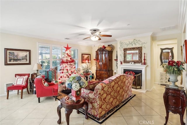 tiled living room featuring ceiling fan and crown molding