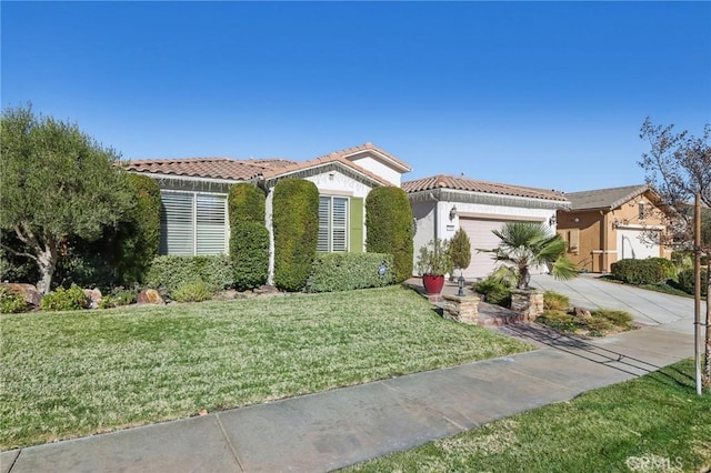 mediterranean / spanish house with a front yard and a garage