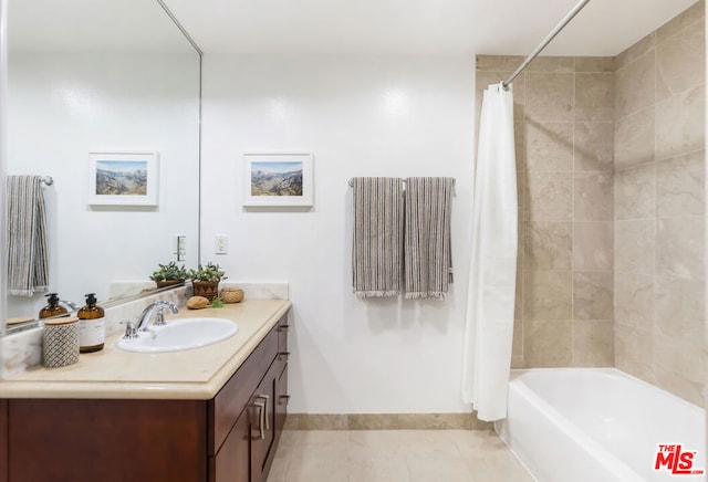 bathroom with tile patterned flooring, vanity, and shower / bath combo