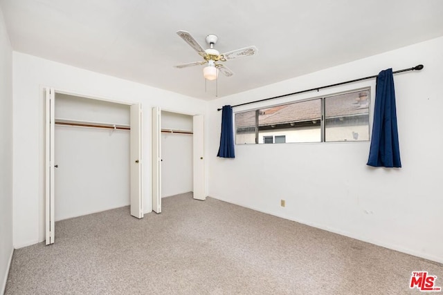 unfurnished bedroom featuring carpet flooring and ceiling fan